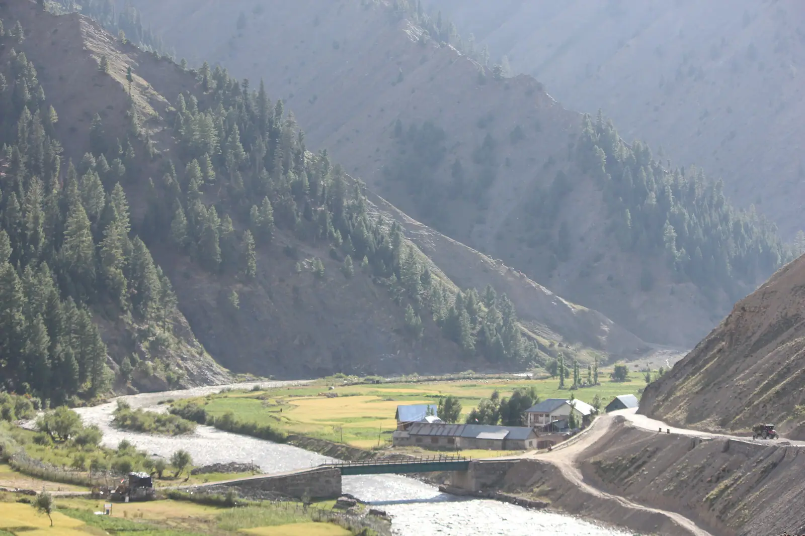 The Kishanganga river and a village in the forested Gurez valley